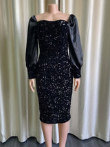 Mannequin displaying a black sequined midi dress with long puff sleeves and a square neckline.