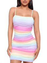 Woman wearing a rainbow gradient bodycon dress with spaghetti straps.