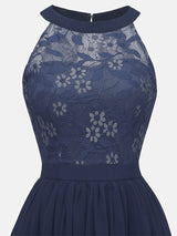 Close-up of the navy blue lace bodice with floral pattern