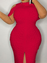 Close-up of a red embellished sheath dress showcasing texture and detail