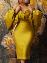 Woman wearing a yellow off-the-shoulder satin midi dress with voluminous bishop sleeves and a V-neckline.