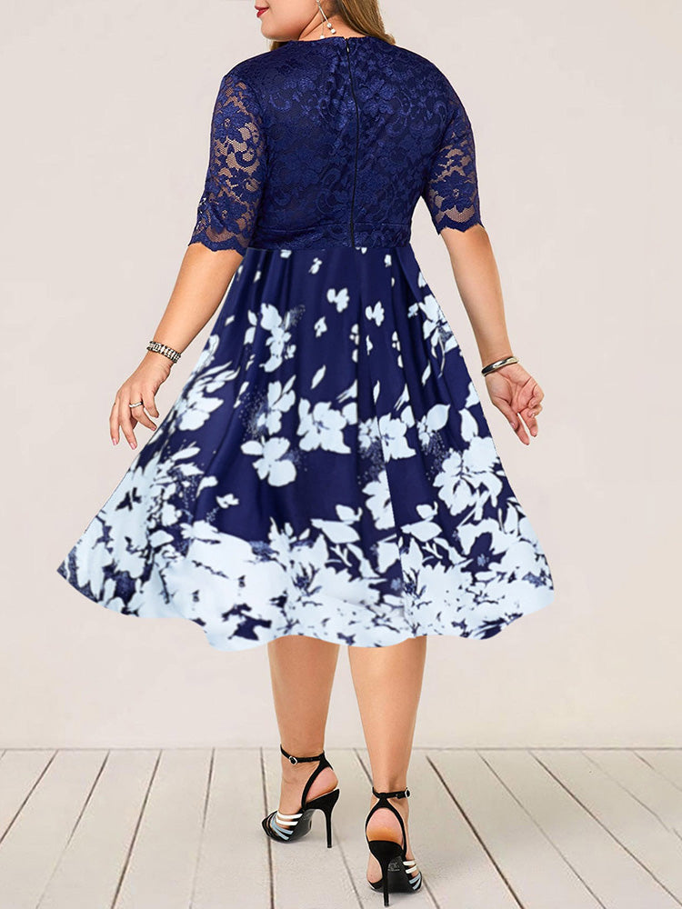 Back view of plus size blue and white floral print fit and flare dress with lace top
