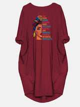 Maroon t-shirt dress with a graphic print of a woman and empowering text, showing the front of the garment.