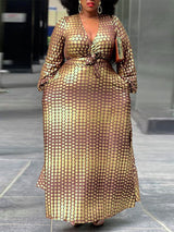 Woman wearing a long brown and gold polka dot maxi dress with long sleeves and a v-neck.