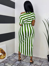 Back view of a woman wearing a green and white striped off-the-shoulder dress
