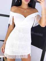 Close-up of a white off-the-shoulder dress with layered fringe.