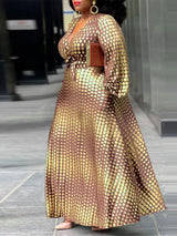 Side view of a woman in a brown and gold polka dot maxi dress, highlighting the A-line silhouette.