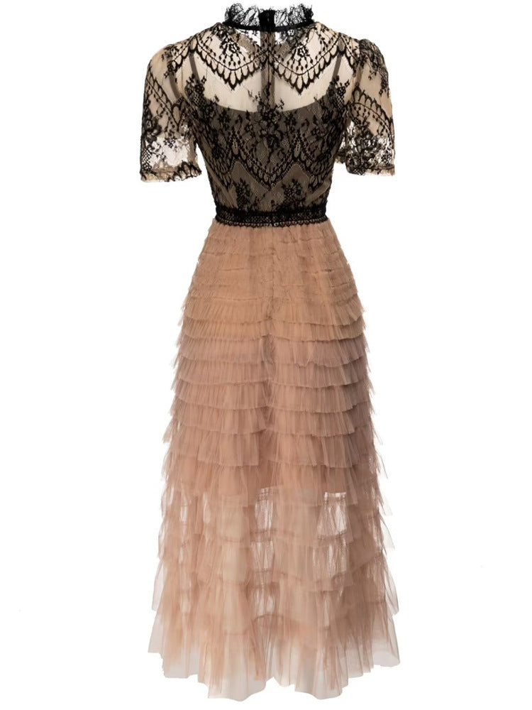 Back view of a black and tan lace and tulle tiered dress
