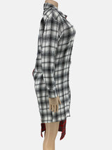 Side view of a mannequin wearing a red and white plaid shirt dress, showing the asymmetrical hemline.