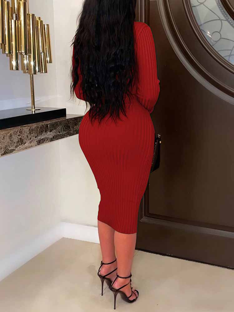 Back view of a woman in a deep red ribbed knit midi dress.