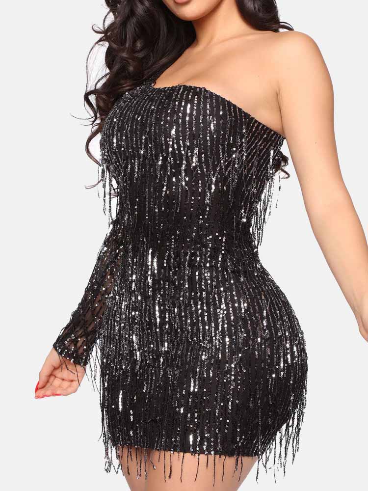 Close-up of a woman wearing a black sequined one-shoulder mini dress with fringe details