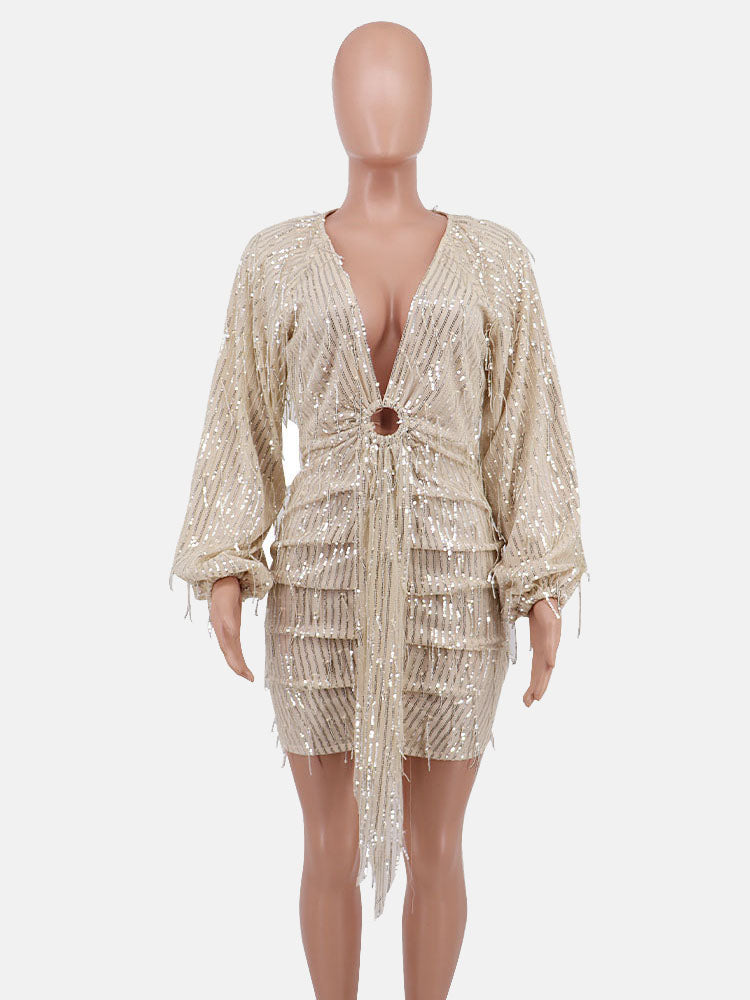 mannequin displaying a sequined mini dress with a plunging neckline