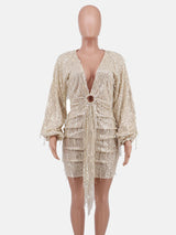 mannequin displaying a sequined mini dress with a plunging neckline