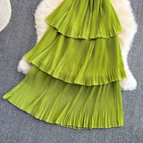 Close-up of green tiered ruffled skirt
