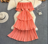Coral tiered off-the-shoulder pleated dress
