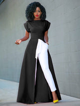 Woman wearing a black high-low maxi dress with white pants and yellow heels