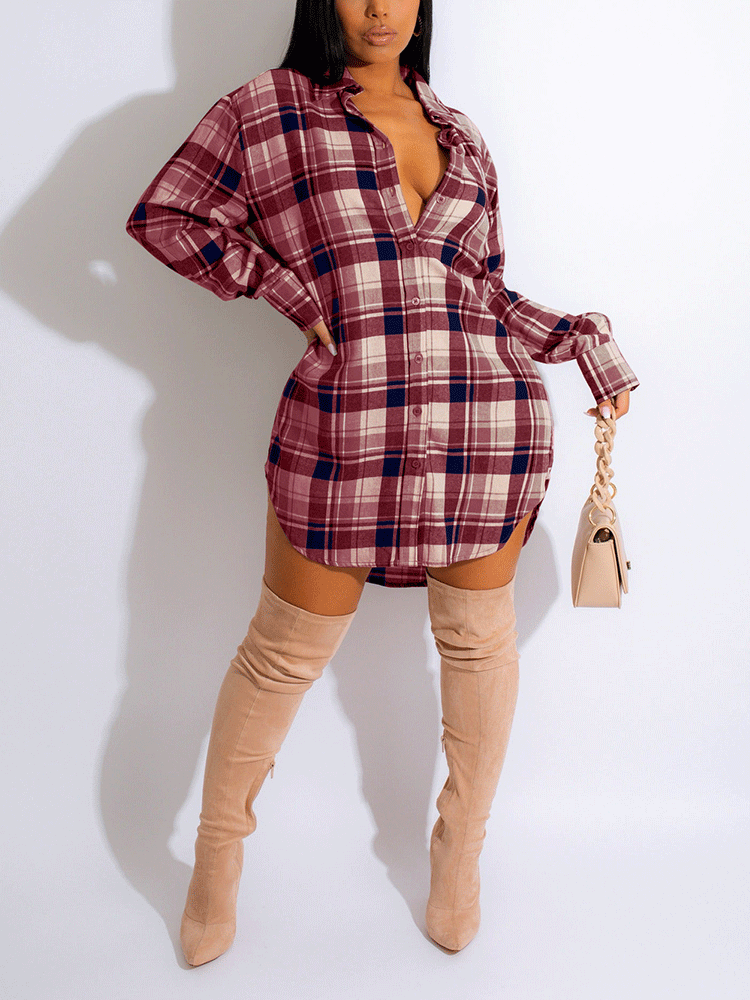 Woman wearing a burgundy and navy plaid shirt dress with thigh-high boots.