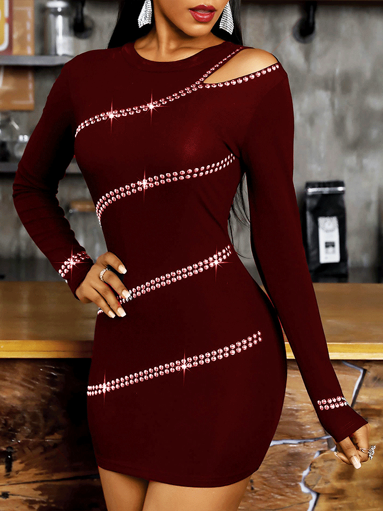 Woman wearing a burgundy long-sleeved bodycon mini dress with diagonal rhinestone embellishments and an asymmetrical cut-out neckline.