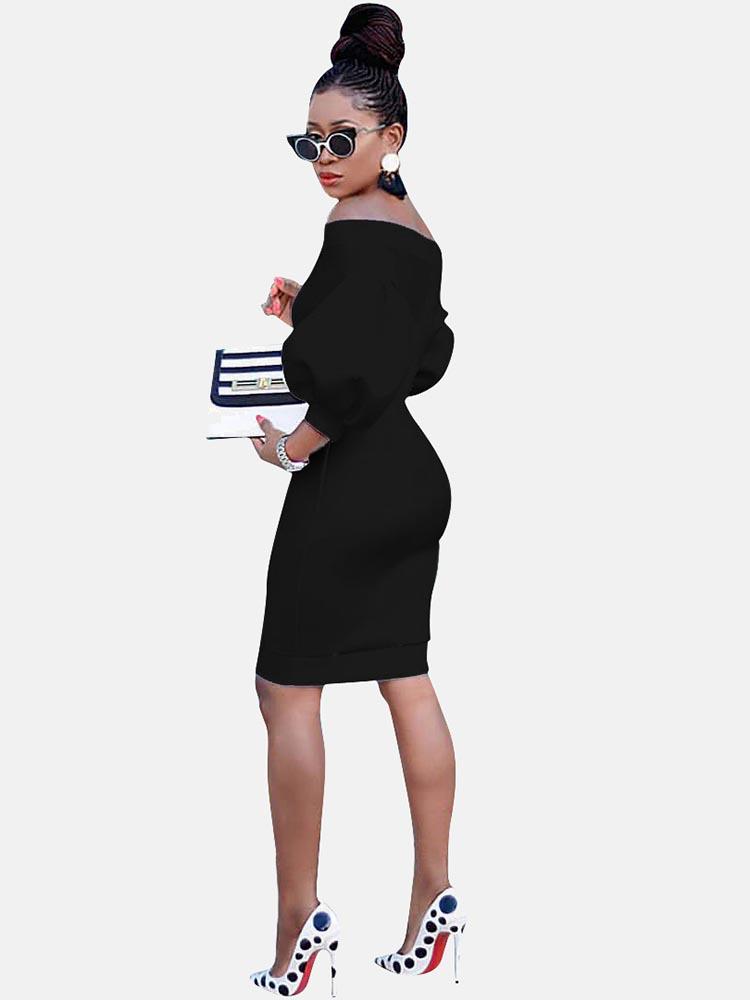 Rear view of a woman in a black off-the-shoulder dress with puff sleeves