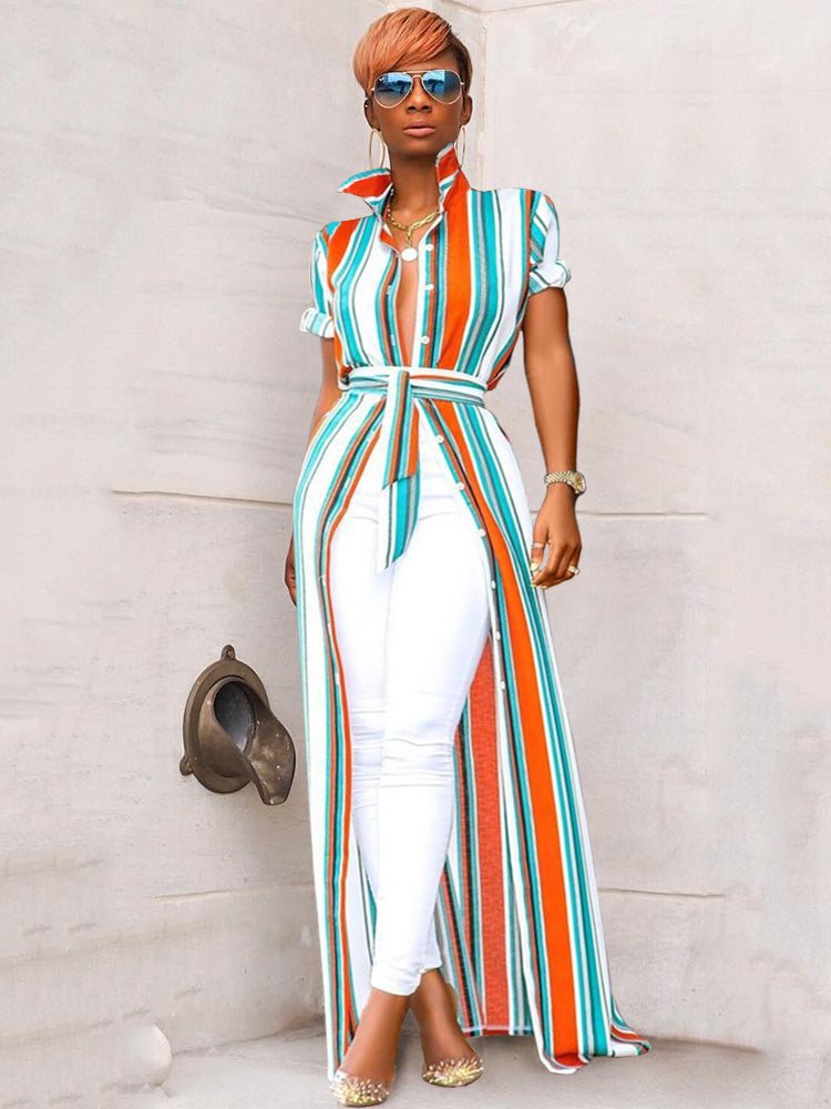 Woman wearing a striped maxi shirt dress with white pants and sunglasses
