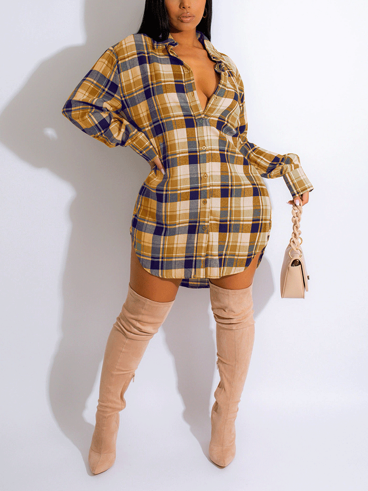 Woman wearing a yellow and blue plaid shirt dress with thigh-high boots.