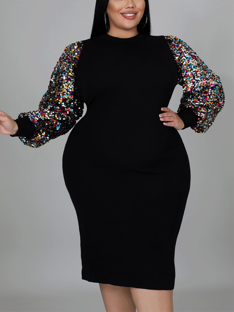Three-quarter view of a woman in a black sheath dress with shimmering sequin sleeves and a mock neckline.