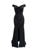 Front view of a black off-the-shoulder ruched formal gown with a high slit