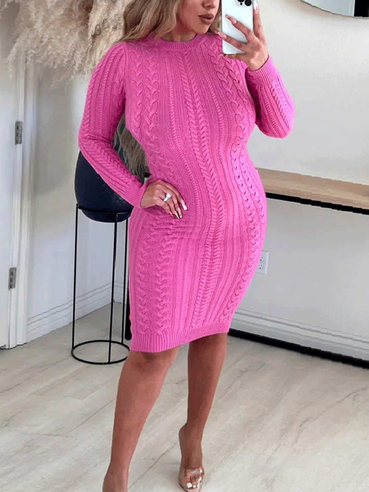 Woman wearing a bright pink cable knit dress from the front