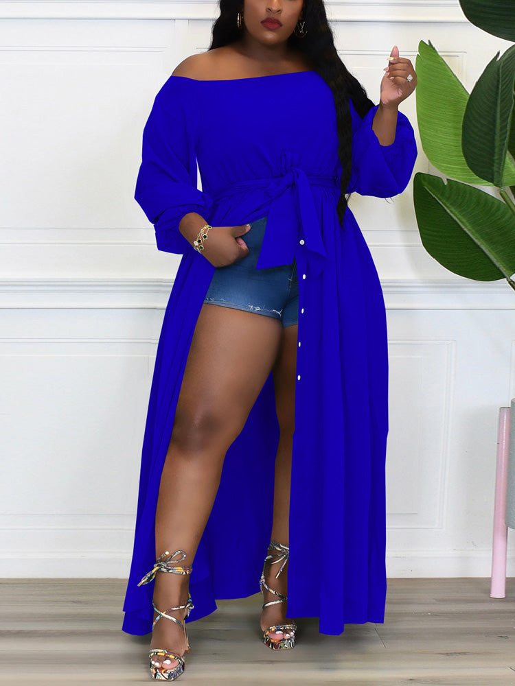 Woman wearing a blue off-the-shoulder maxi dress with a belted waist and high slit