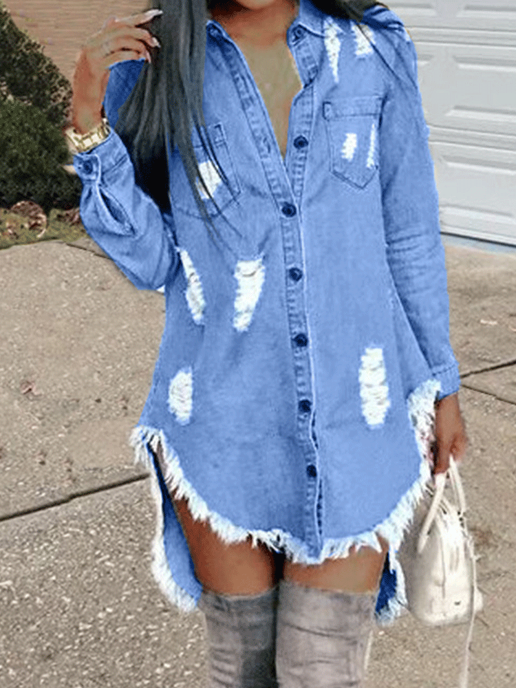 Close-up of a woman in a distressed denim shirt dress with raw hem and grey knee-high boots