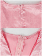 Detail shots of the zipper closure on the back and front neckline of a pink satin dress.