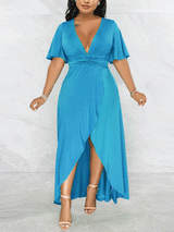 Full-length view of a woman in a blue wrap maxi dress