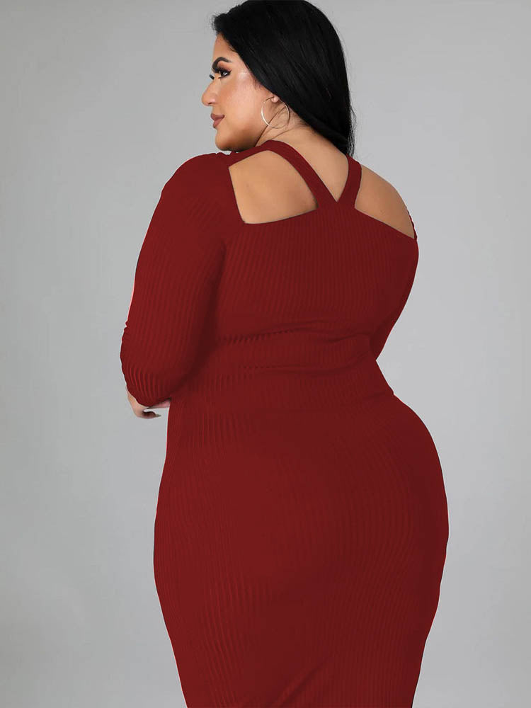 Back view of a woman wearing a burgundy long-sleeved ribbed knit bodycon dress with a cutout neckline.