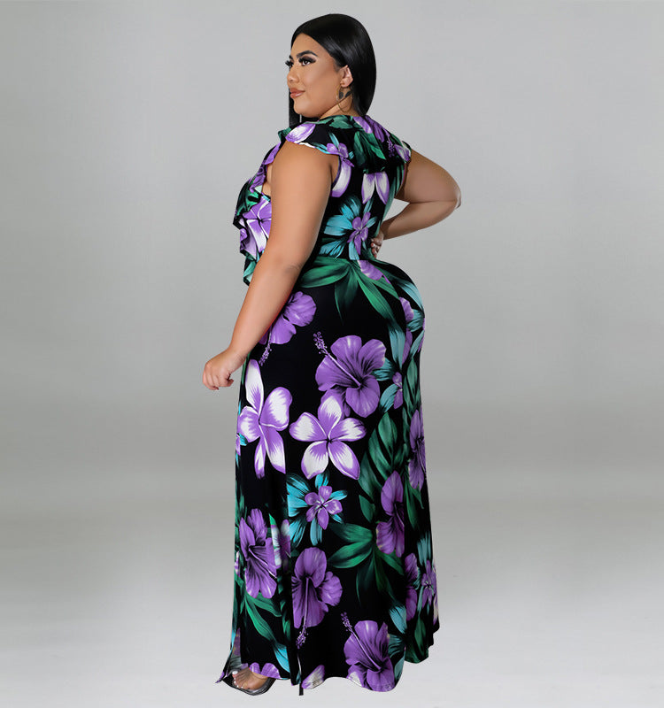 Back view of a woman in a black maxi dress with a purple and green floral print.
