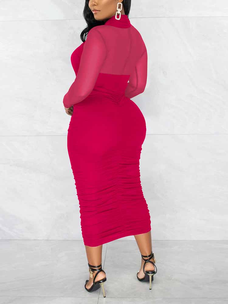 Back view of a woman in a magenta ruched sheath dress with a criss-cross neckline and sheer long sleeves.