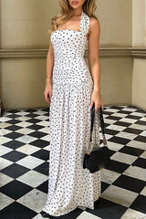 full length shot of woman in white polka dot maxi dress