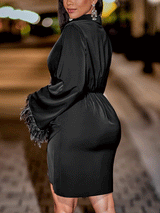 side view of the black satin dress highlighting the silhouette