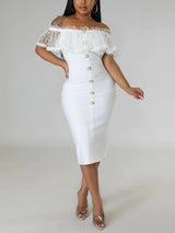Woman wearing a white off-the-shoulder midi dress with ruffled overlay and button detailing.