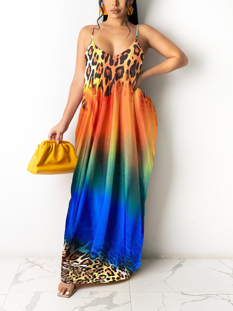 Woman wearing a leopard print and gradient maxi dress with spaghetti straps and a V-neckline, holding a yellow clutch.