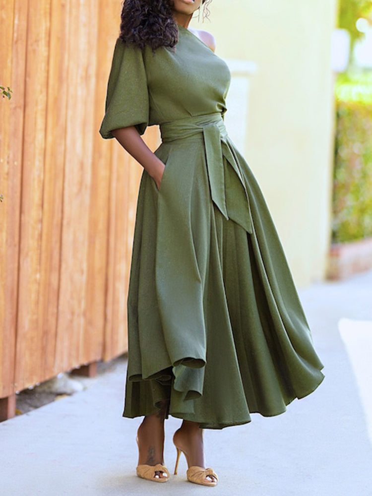 Fashionable green dress with a flowing skirt