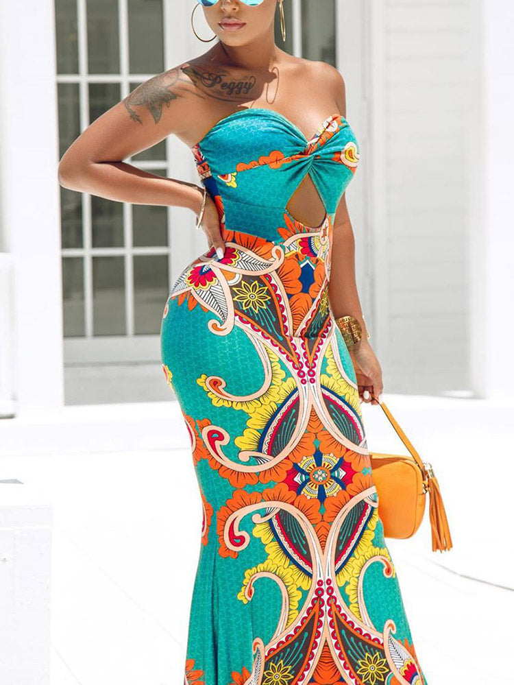 Close-up of a woman's upper body in a strapless printed maxi dress