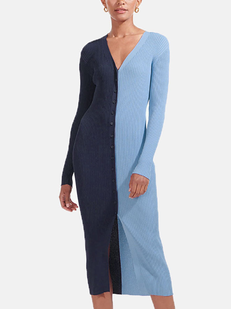 Woman wearing a navy and light blue color-block ribbed knit midi dress with a button-down front and v-neck