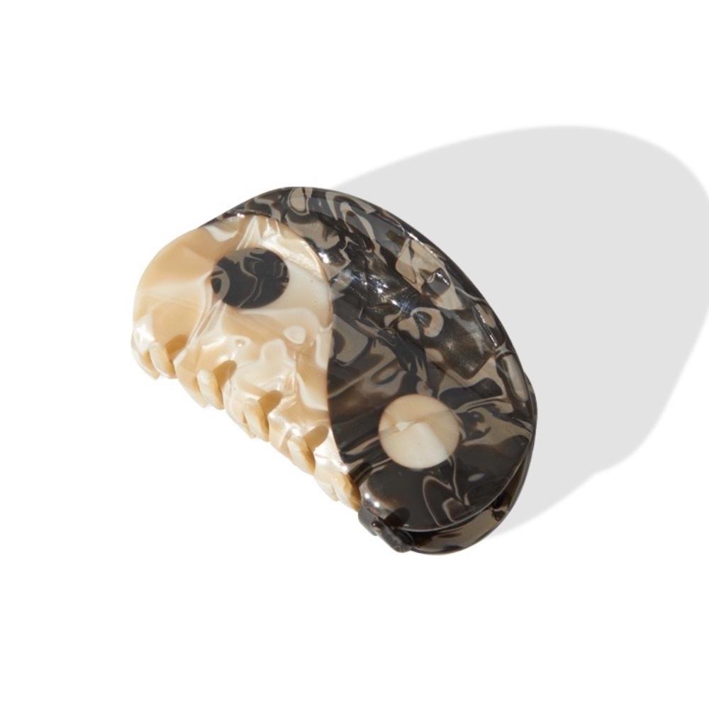 Close-up of a Yin Yang hair claw clip