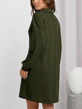 Back view of a woman in an olive green waffle knit shirt dress
