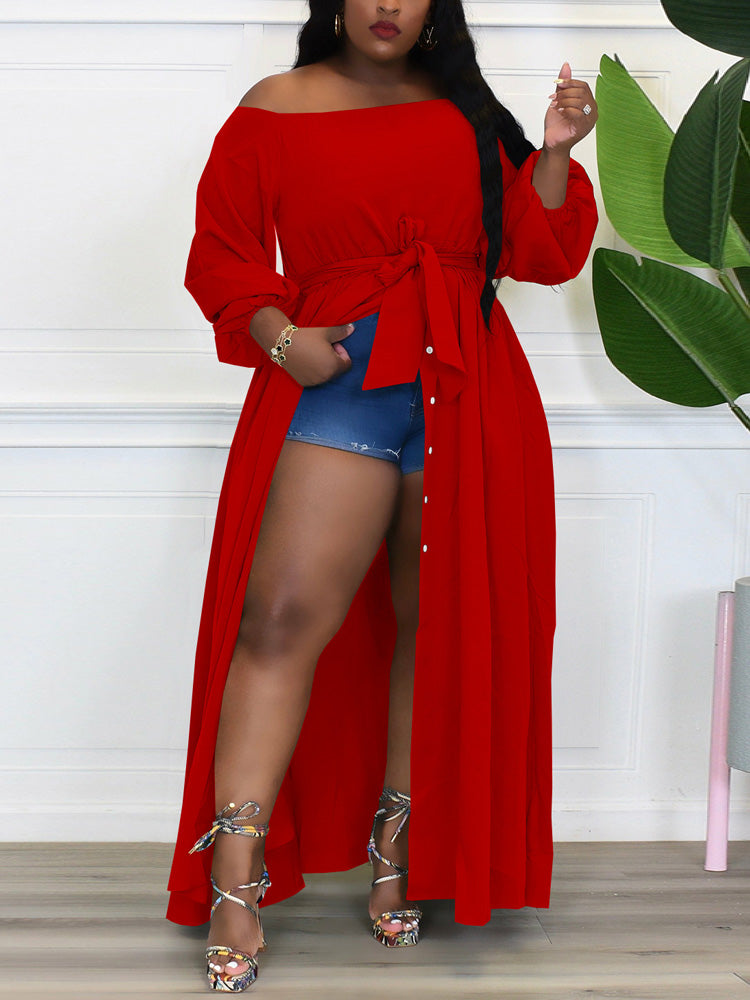 Woman wearing a red off-the-shoulder maxi dress with a belted waist and high slit