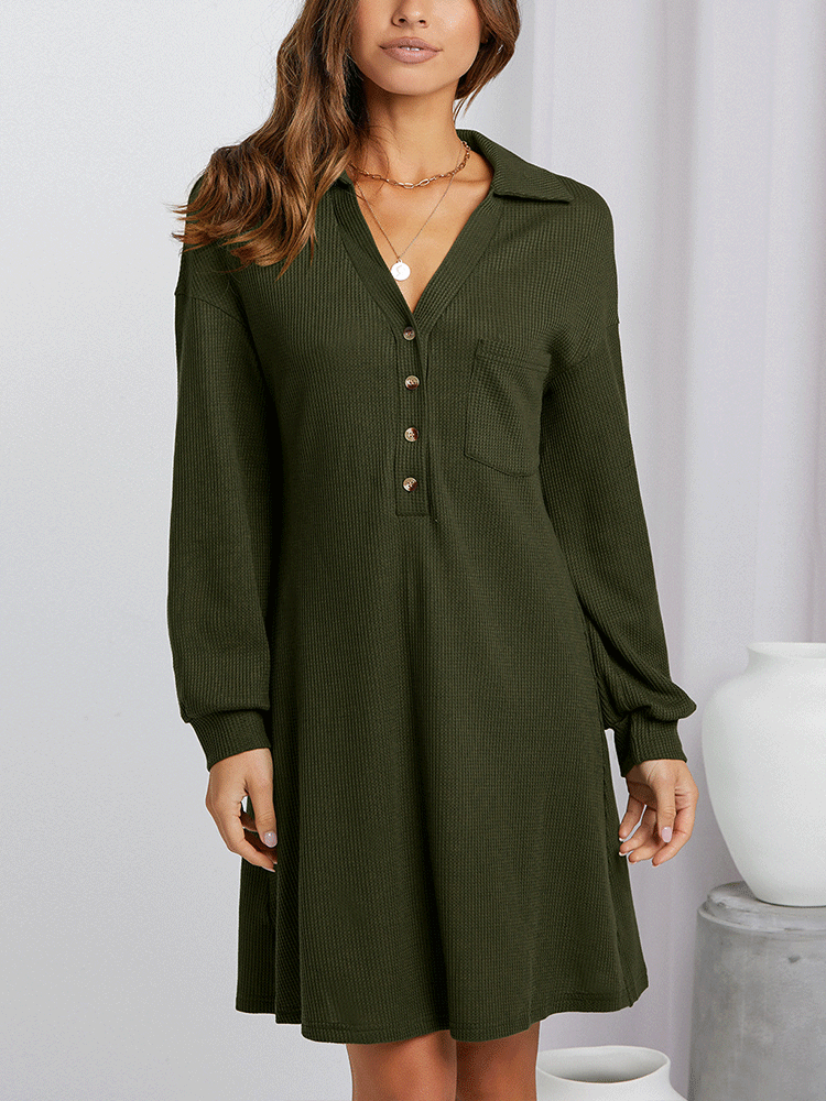 Full body shot of a woman in an olive green waffle knit shirt dress