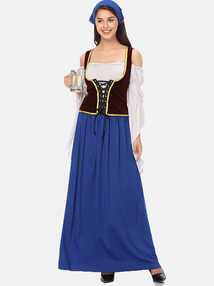 Full-length view of a woman wearing a blue headscarf, white blouse with off-the-shoulder detail, burgundy vest with lace-up front, and a long blue skirt.