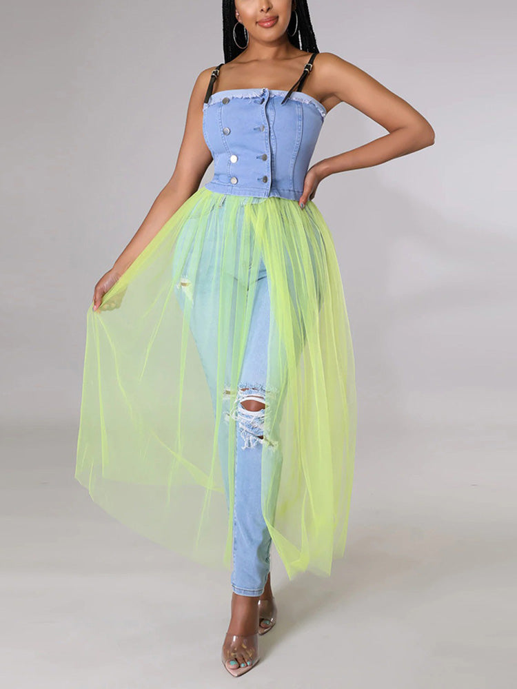 Woman wearing a light blue denim corset top with a long, sheer neon yellow tulle skirt over ripped light blue jeans, front view.