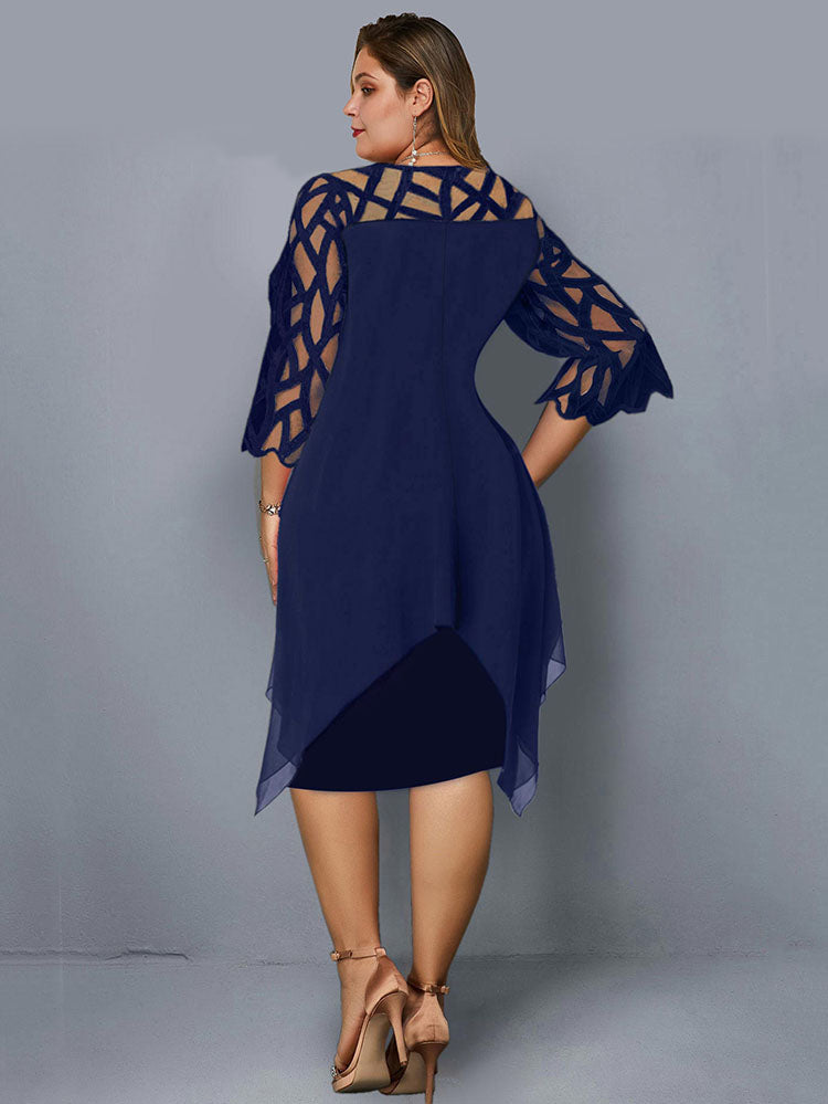 Back view of a plus-size woman wearing a navy blue layered dress with geometric mesh sleeves and an asymmetrical hemline.