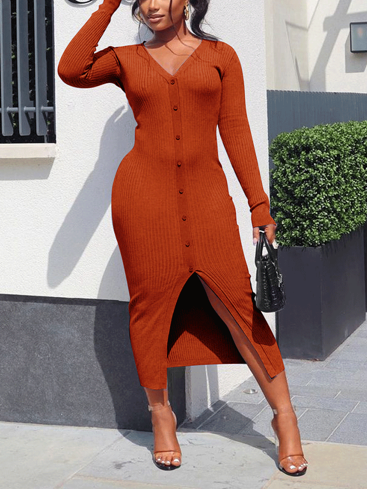 Woman posing in an orange long-sleeve ribbed knit midi dress with a v-neck and front slit.